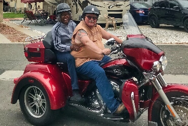 Image onf elderly man and lady on a motorcycle